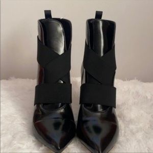 Black strapped boots heels